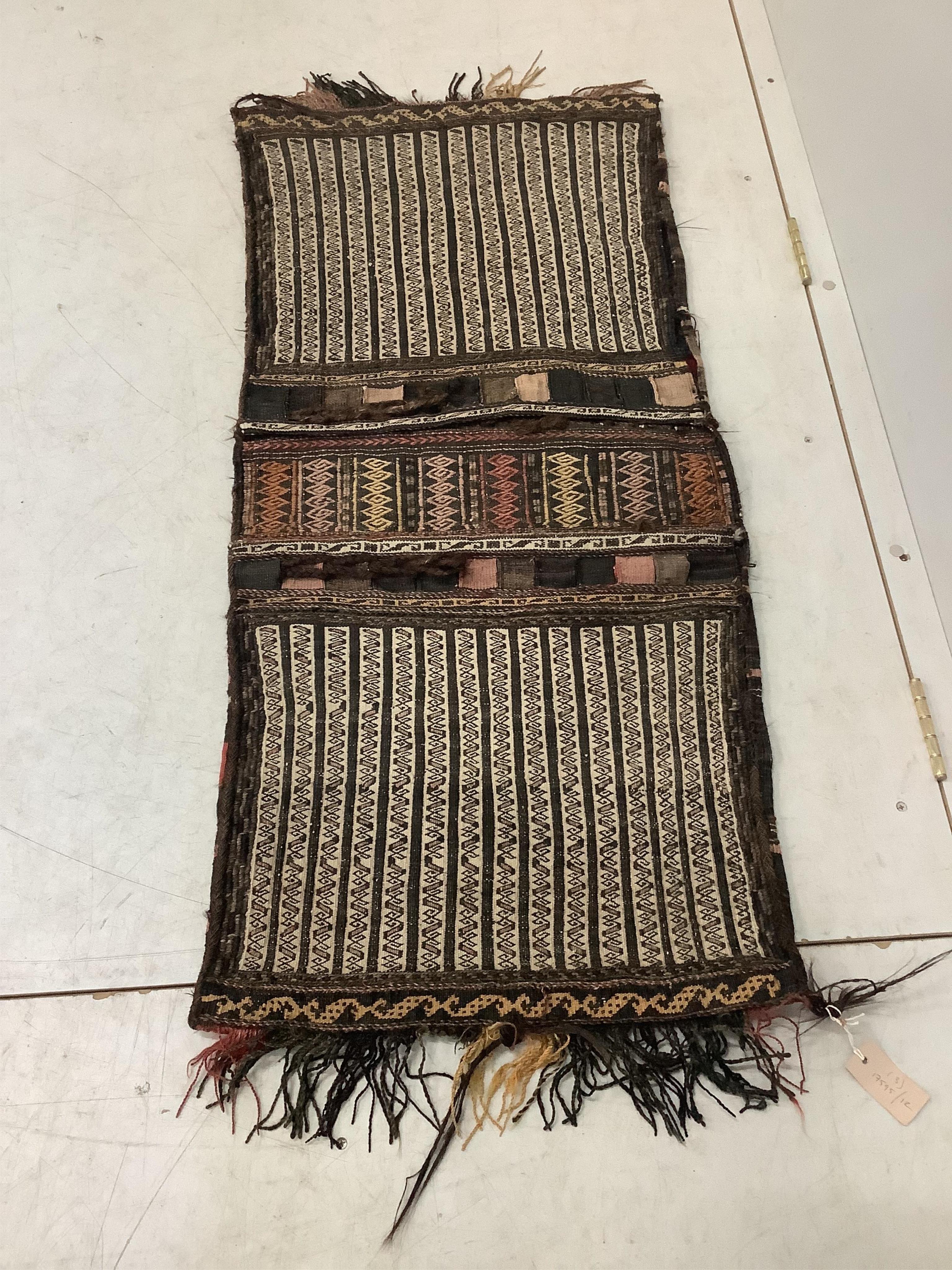 An Afghan flatweave salt bag, a double saddle bag and one other bag, largest approximately 120 x 80cm